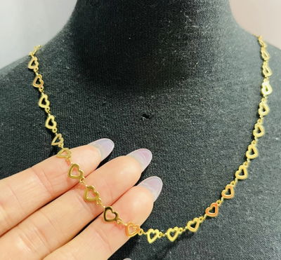 Cadena corazones acero dorado
