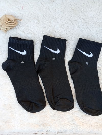 1/4 Nike negra. Adulto. LC