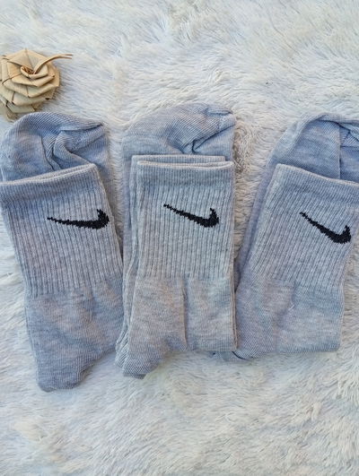 Nike GRIS PIPA NEGRA. Adulto. LC