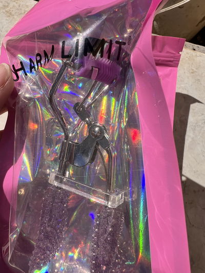 Arqueador con cepillo para separar pestañas