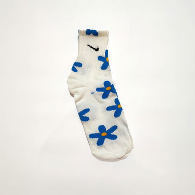 NIKE - FLORES CELESTES