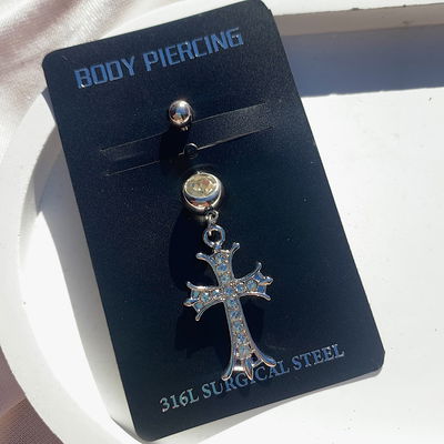 Piercing ombligo: cruz