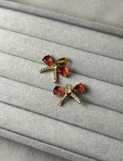 DIJE MOÑO CRISTAL FUCSIA