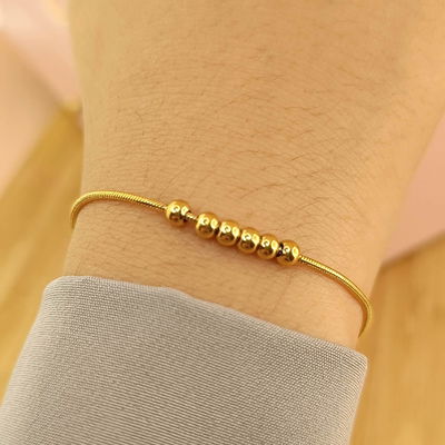 Pulsera cola de ratón con bolitas. 