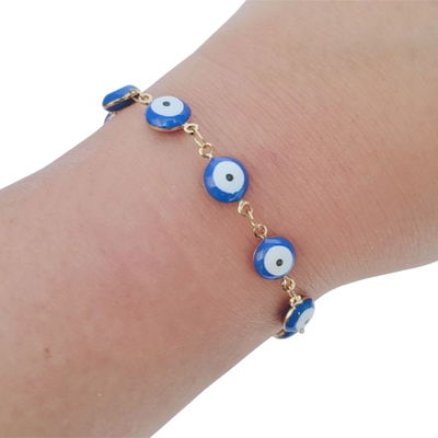 Pulsera de acero quirúrgico dorado  con dijes ojo turco. 