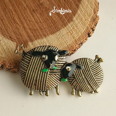 Pin tejido dos agujas