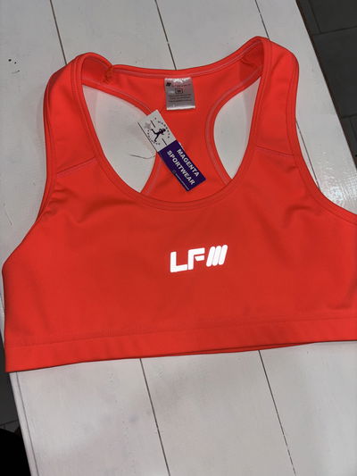 Top LADYFIT espalda deportiva - naranja flúo - talles 1/2
