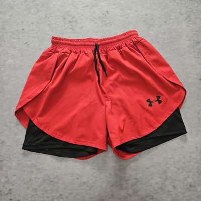 SHORT ROMPEVIENTO UNDER ROJO