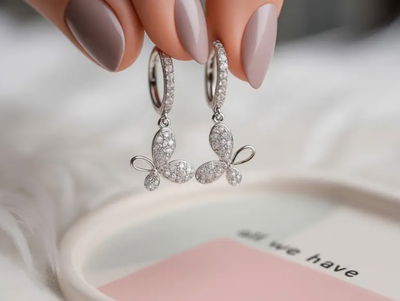 AROS ARGOLLAS MARIPOSAS PLATA Y MICROPAVEE