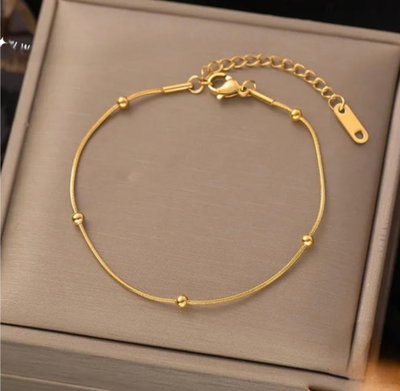 PULSERA DORADA CON BOLITAS