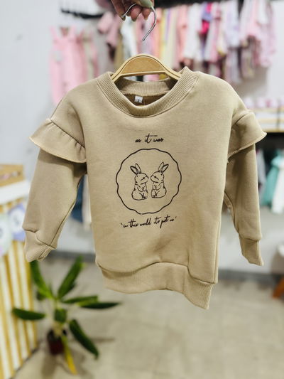 BUZO FRIZA CON VOLADOS BUNNY BEIGE