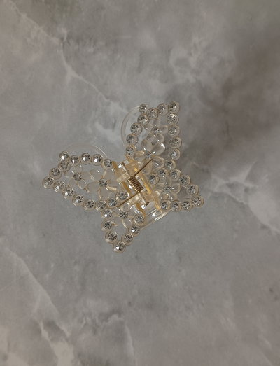 Broche de mariposa con brillo