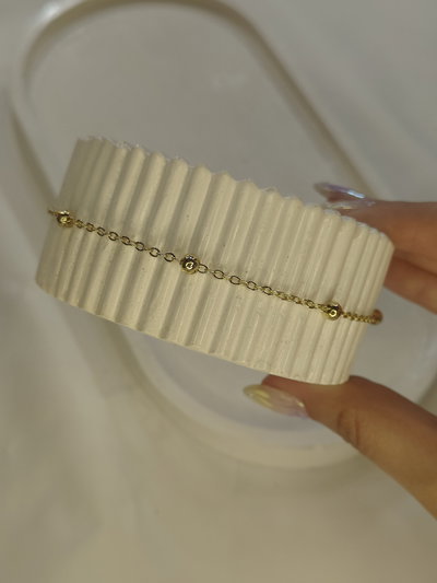 Tobillera bolitas dorada