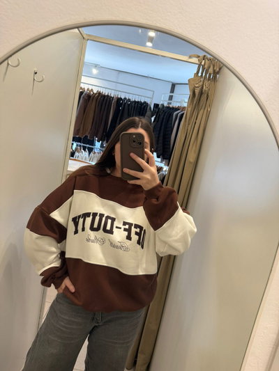 buzo rayado marron con blanco