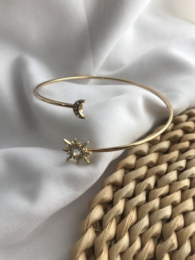 Brazalete sol y luna acero dorado