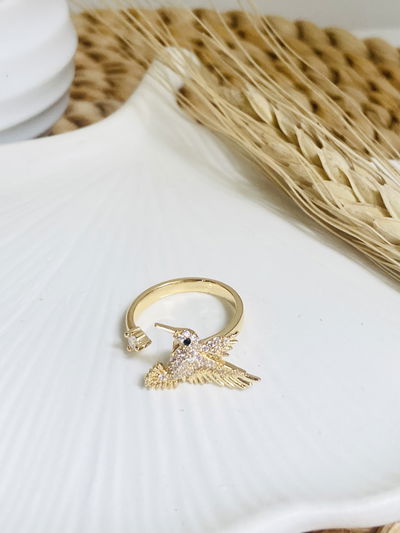 Anillo dorado giratorio colibri (Cobre con baño dorado)