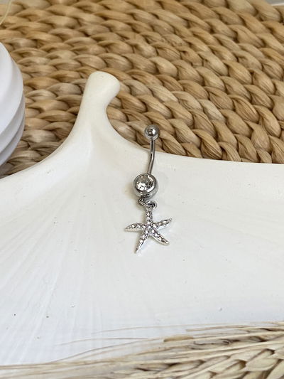 Piercing ombligo estrella de mar