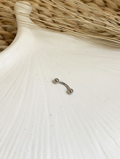 Piercing ceja doble pelotitas 12mm