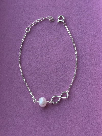 Pulsera infinito y perla