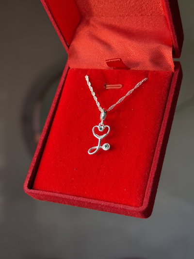 Conjunto de plata estetoscopio cubic verde
