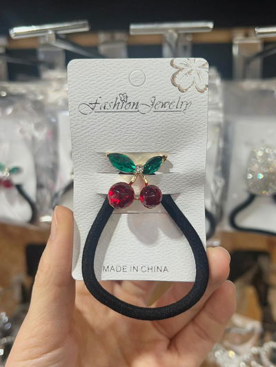 COLITA DE PELO CON APLIQUE DORADO Y STRASS X UNIDAD