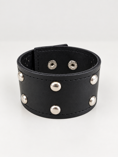 PULSERA ANCHA ECOCUERO NEGRO CON TACHAS X UNIDAD