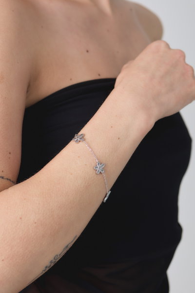 PULSERA ACERO TRES FLORES X UNIDAD