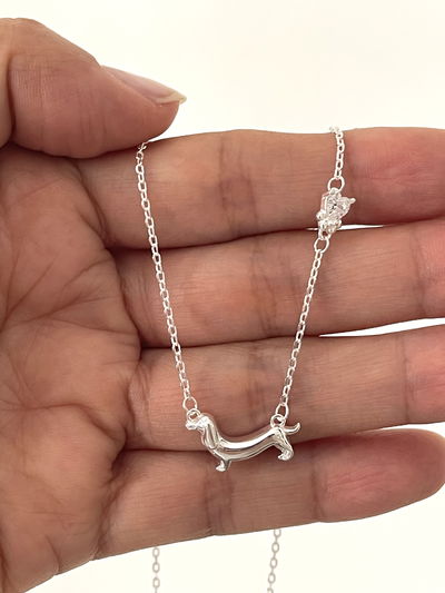 Conjunto cadena dije pero salchicha y punto de luz corazon