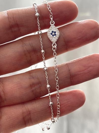 Pulsera doble con dije ojo turco