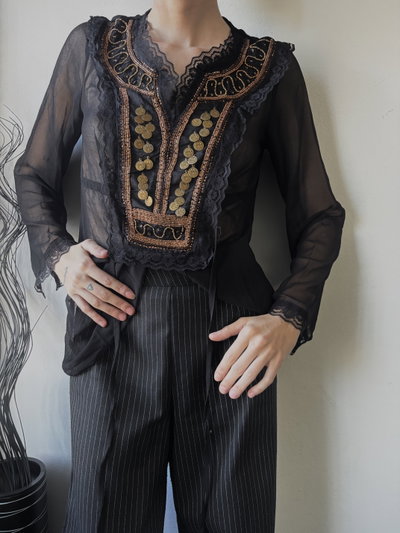 Blusa monedas