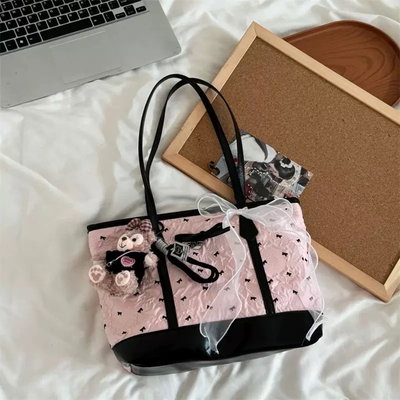 Cartera de hombro con moño rosa 