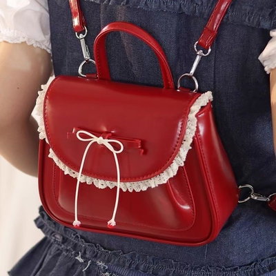 Mini mochila de charol y lazo