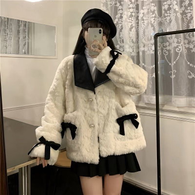 Campera corderito con cuerina y moños 