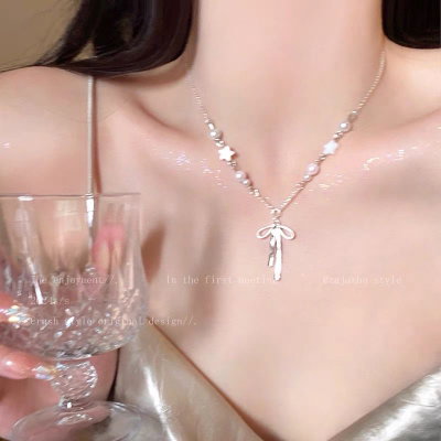 collar lazo y estrellas