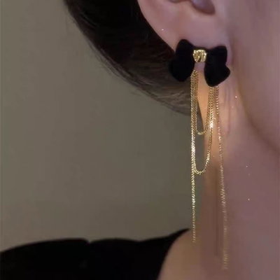 Arete largo moño con cadena 
