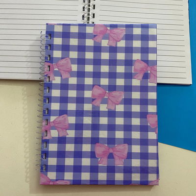 Cuaderno A5/50 hojas rayadas - Tapa Moñitos 