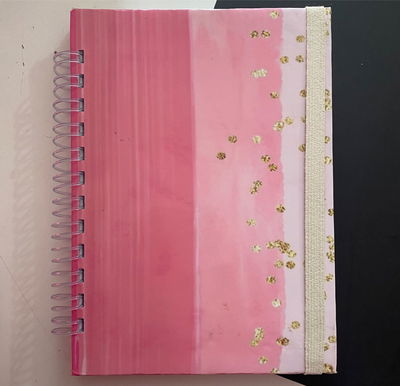 Cuaderno A5/100 hojas lisas con Elastico