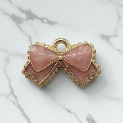 Dije Esmaltado Moño Rosa Acero Dorado - 400105