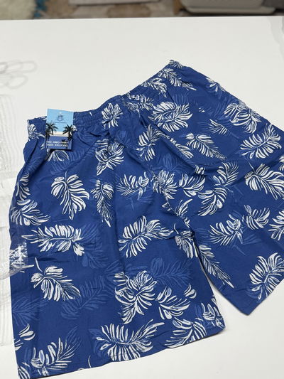 Short malla hombre hojas