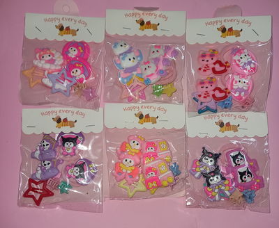 set de Colita mas broches de pelo sanrio x 6 u