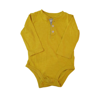 CARTERS - Body amarillo 9 meses nuevo
