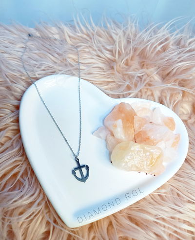 Cadena con dije ancla.