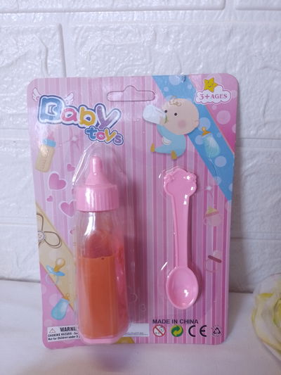 Mamadera mágica  + cuchara 