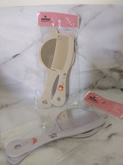 Peine con espejo de mano