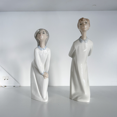 Duo de Lladro niños dando un beso