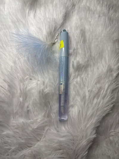 Gloss con pluma