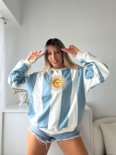BUZO ARG FRIZADO CELESTE - RAYAS VERTICAL - 