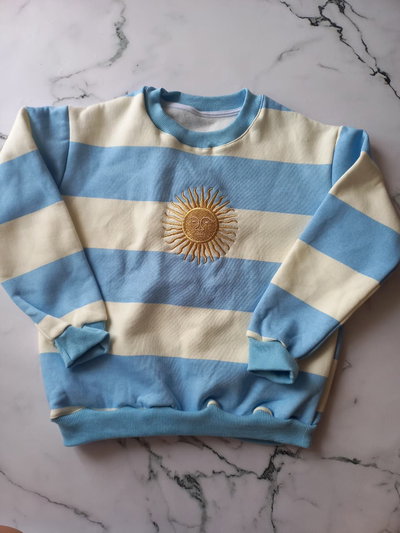 BUZO FRIZADO ARG KIDS - CELESTE -