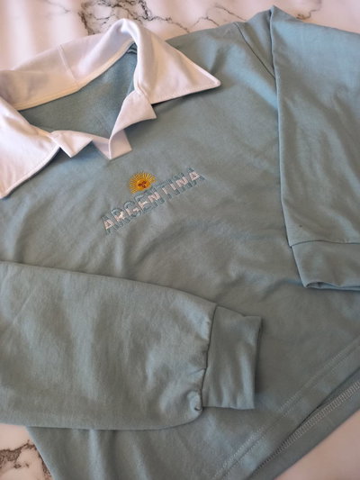 BUZO CHOMBA ARG SOL DE MAYO CELESTE