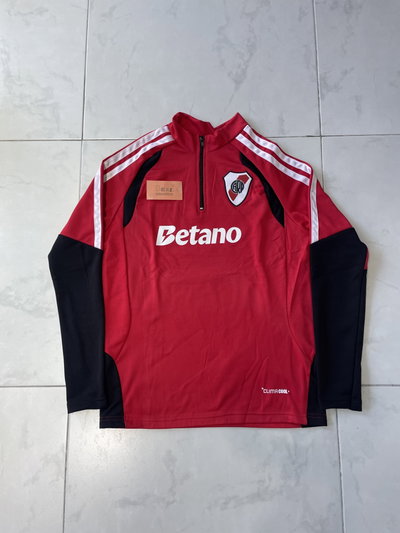 Buzos river rojo medio cierre 2026